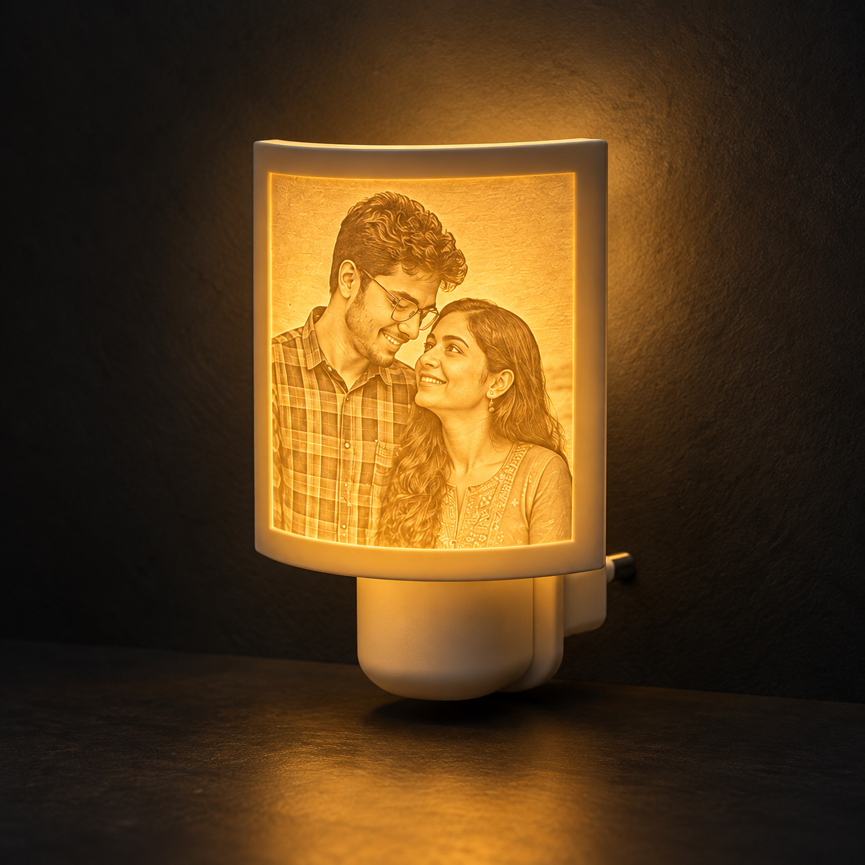Lithophane photo night lamp glowing in a dark studio
